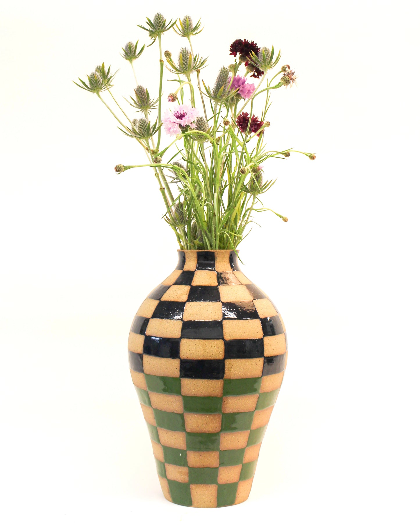 Handmade Blue and Green Checkered Ceramic vase with flowers on a white background from Mima Ceramics by Michelle Organ.