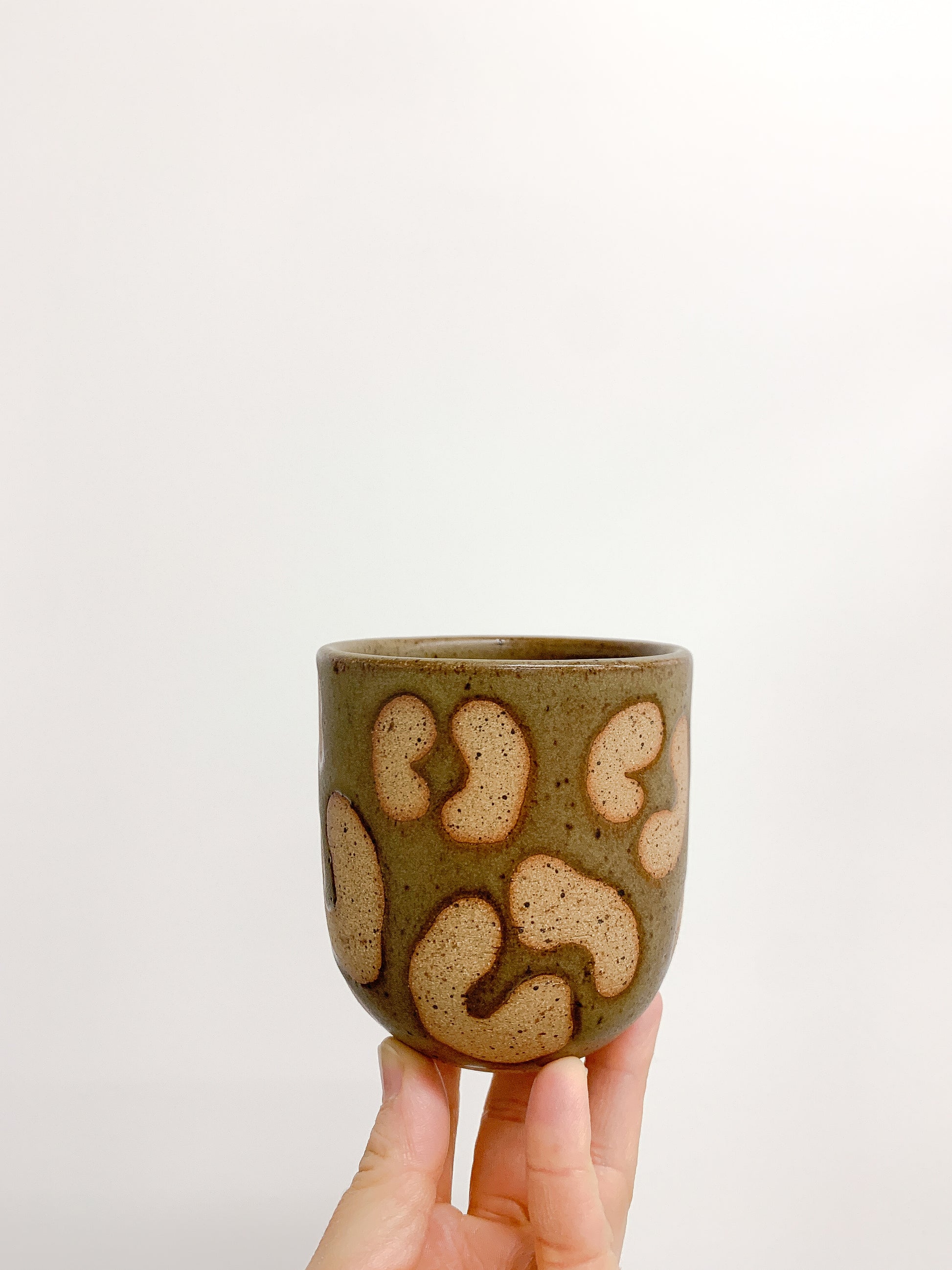 Handmade Ceramic Drinking Cup in Olive Green Animal Print from Mima Ceramics by Michelle Organ