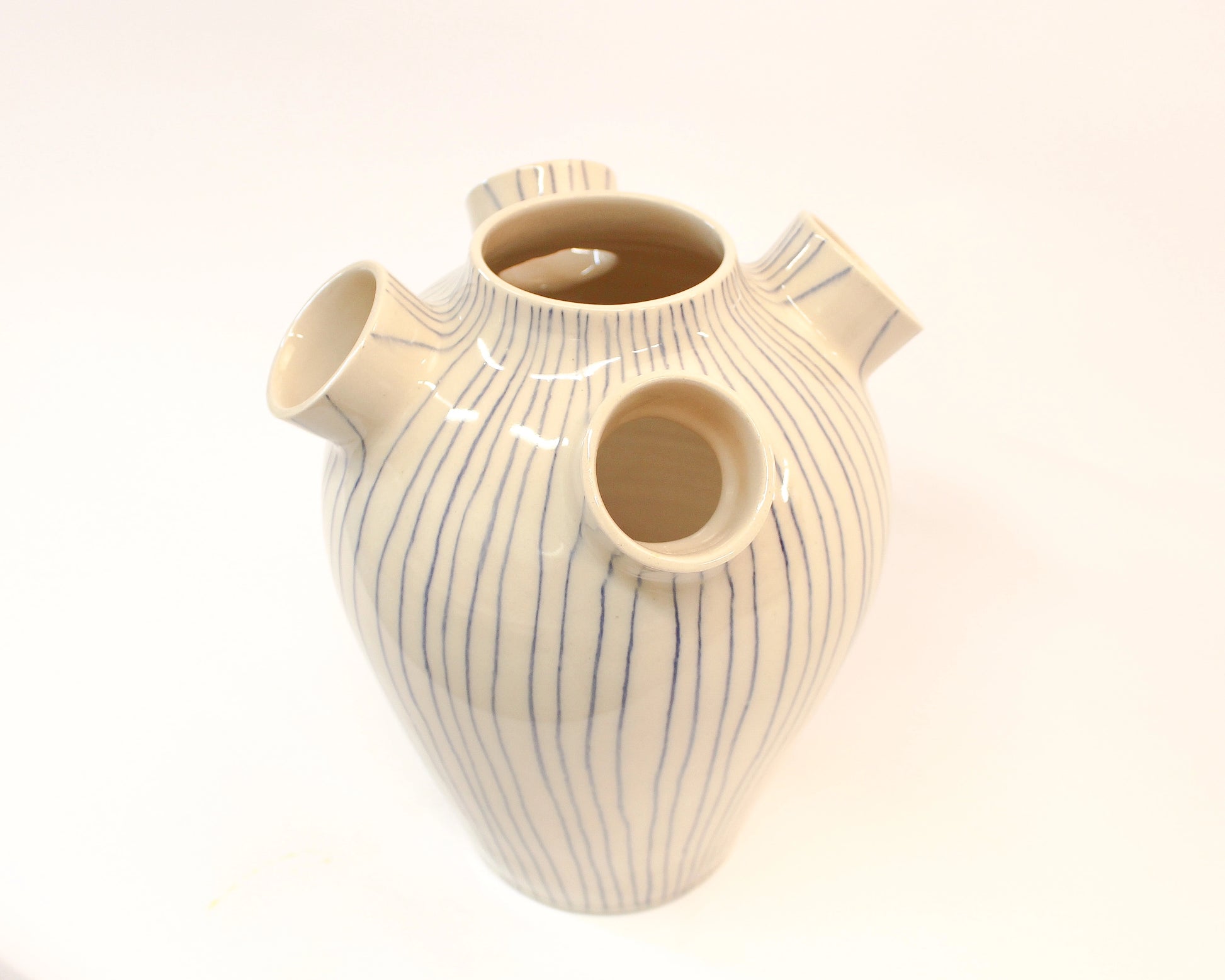 Handmade White Ceramic vase with blue stripes on a white background from Mima Ceramics by Michelle Organ. 