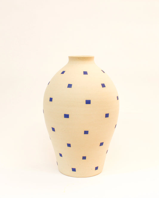 Handmade White vase with blue square patterns on a white background from Mima Ceramics by Michelle Organ. 